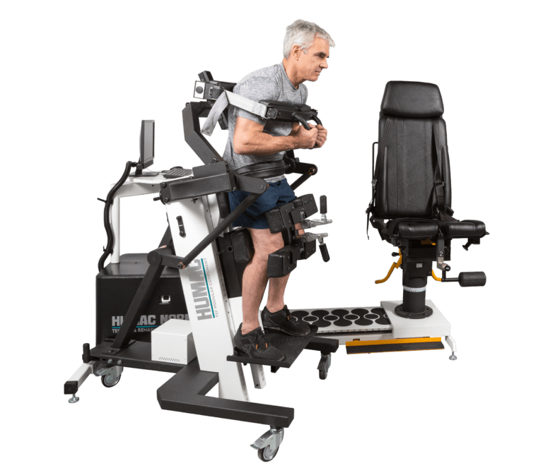 patient strapped into TMC attachment of humac norm extremity system